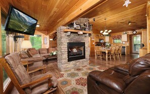 Televisio, takka, DVD-soitin, pöytäjalkapallopöytä