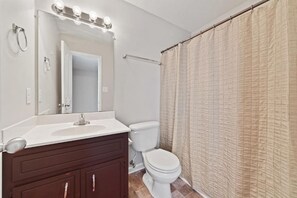 Combined shower/bathtub, hair dryer, towels, toilet paper