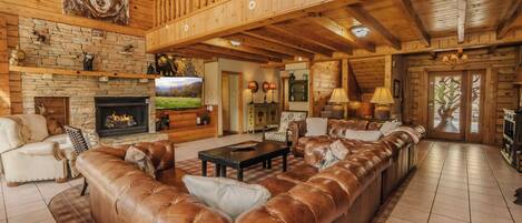 Télévision, cheminée, lecteur de DVD, baby-foot