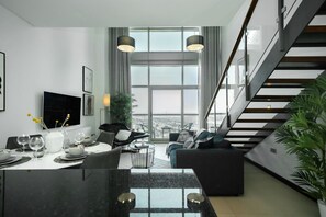 City Apartment | Living area | Flat-screen TV - HiGuests - Liberty House (Dubai)