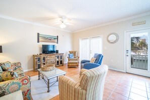 Flat-screen TV, DVD player, books