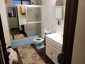 Combined shower/tub, hair dryer, towels, soap