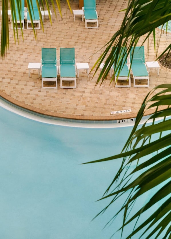Outdoor pool, open 7:00 AM to 11:00 PM, pool umbrellas, pool loungers