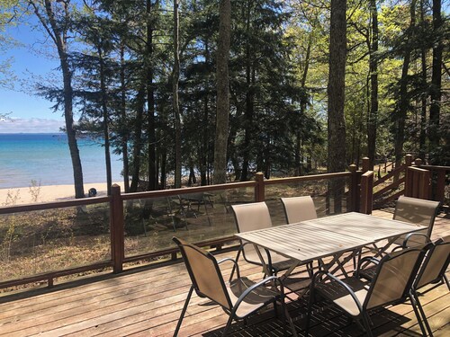 House on sandy beach in Omena. Budget friendly. Dog ok. Sunrise views.