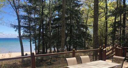 House on sandy beach in Omena. Budget friendly. Dog ok. Sunrise views.