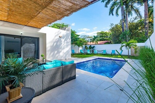 Ultramodern Townhome with an Inviting Coastal Design and Lush Outdoor Oasis with a Private Pool