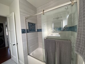 Combined shower/tub, hair dryer, towels, soap
