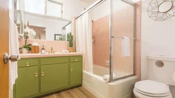 Bathtub, hair dryer, shampoo