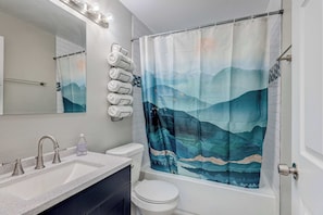 Bathtub, hair dryer, towels