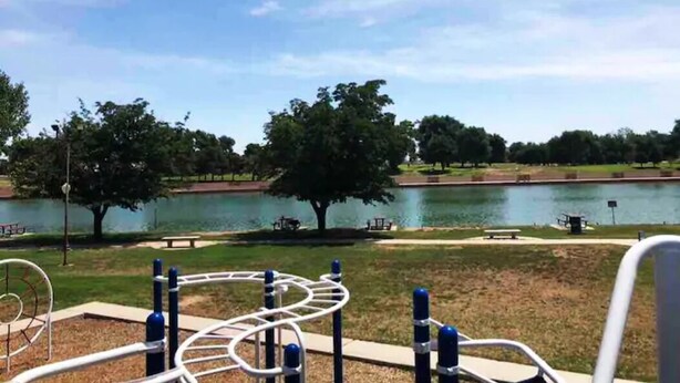 A park with exercise equipment, a lake, and trees. - (M1) Enchanted Getaway ☀ 3-Mins Walk To River❣ (Carlsbad)