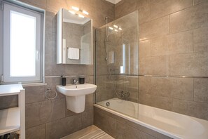 Bathtub, hair dryer, towels