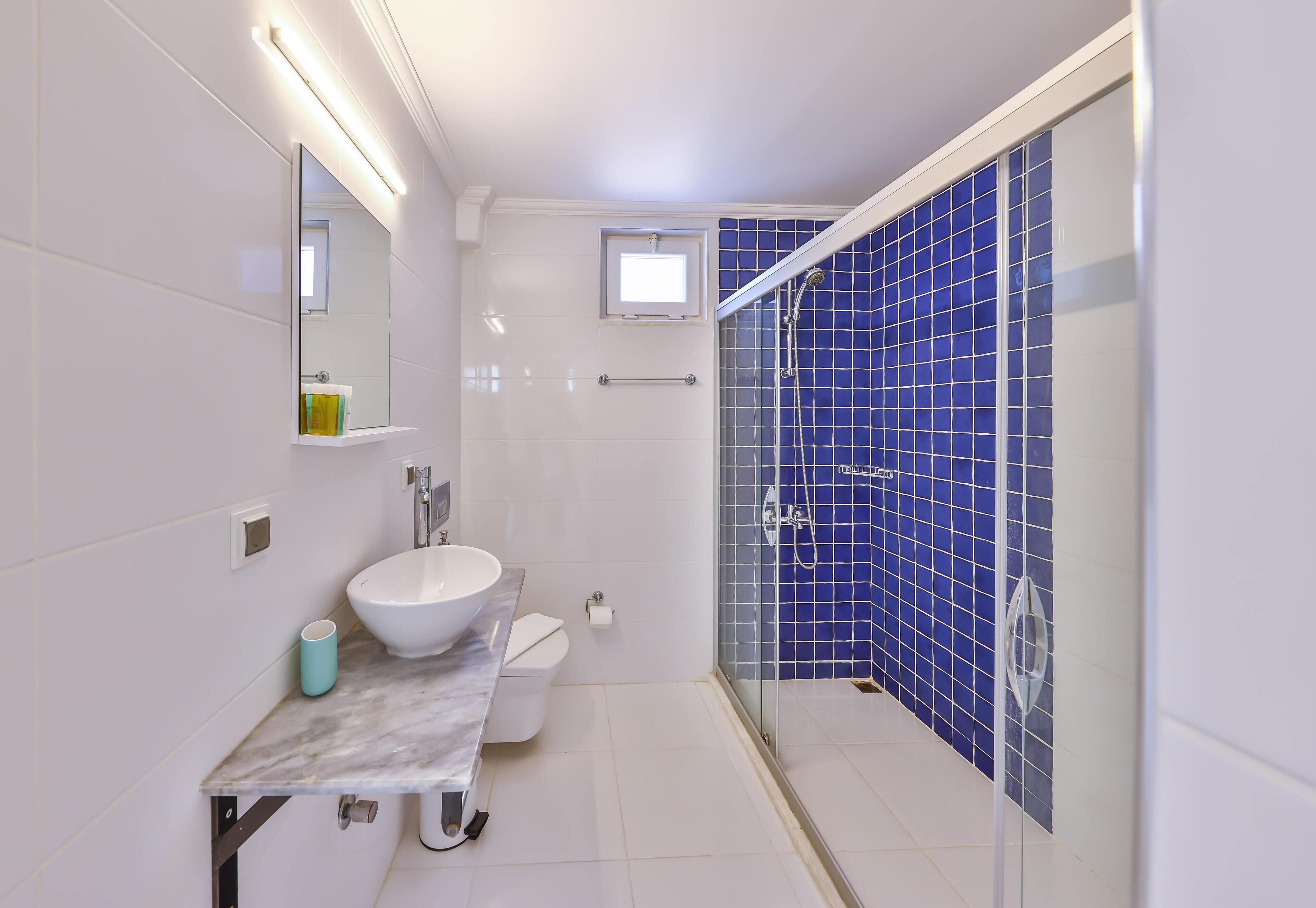 economy twin room | bathroom | shower, rainfall showerhead, hair dryer, towels