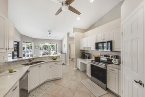 Fridge, microwave, oven, stovetop - Peaceful Waterfront Home | Pool & Steps to Beach (Marco Island)