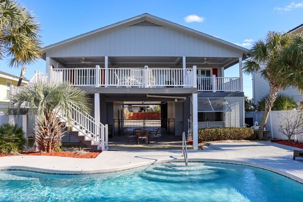 Enjoy a balcony with a view of the pool and garden.