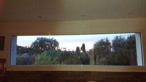 A large window with a view of a garden and trees. - New detached house (Corbara)