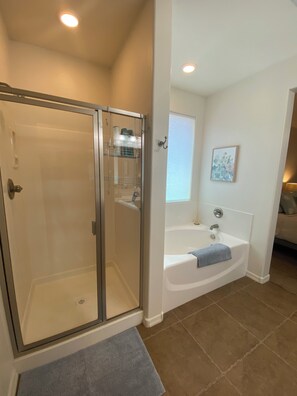Combined shower/tub, hair dryer, towels, soap
