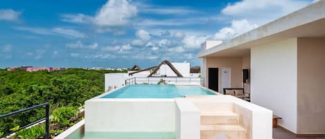 Outdoor pool, open 9:00 AM to 10:00 PM, pool loungers