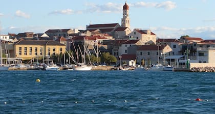 Frantoio House. Charming stone house in front of the dock