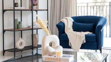 Deluxe Apartment | Living area | 50-inch flat-screen TV with cable channels, TV