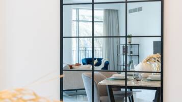 Deluxe Apartment | Living area | 50-inch flat-screen TV with cable channels, TV