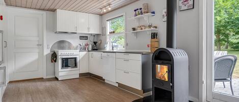 Fridge, stovetop, dishwasher, coffee/tea maker