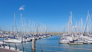A marina with numerous sailboats docked in calm waters under a clear blue sky. - Beautiful home in Sint-Annaland (Sint-Annaland)