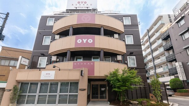 A multi-story hotel building with a prominent 'OYO' sign on the facade. - Oyo 44646 Wa Style Tokyo (Kawaguchi)