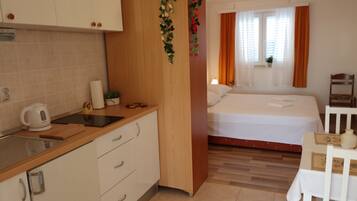 Studio (Standard Studio apartment) | Private kitchenette | Fridge, stovetop, electric kettle, cookware/dishes/utensils