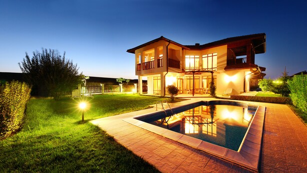 A two-story house with a swimming pool, surrounded by well-maintained lawns and hedges. - Generaator House (Pomorie)