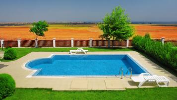 Indoor pool, seasonal outdoor pool, pool umbrellas, sun loungers