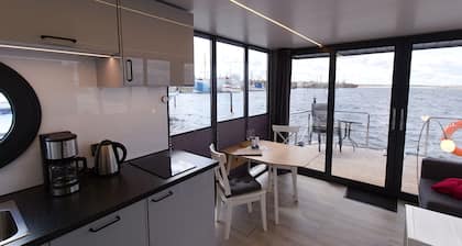 Houseboat Fjord Auriga with bio sauna and roof terrace in Wendtorf / Kiel Fjord