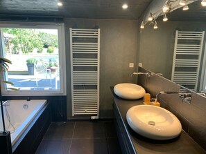 Combined shower/tub, hair dryer, towels, toilet paper