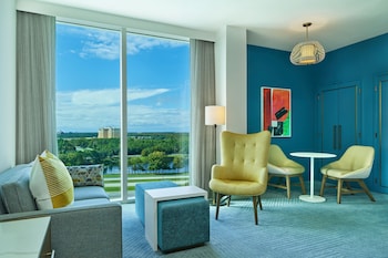 Junior Suite, 1 King Bed with Sofa bed | Living area | 49-inch flat-screen TV with satellite channels, TV, pay movies at Walt Disney World Swan Reserve