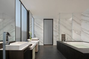 A modern bathroom with a large bathtub, a double sink vanity, and a large mirror. - Liyang Marriott Hotel (Changzhou)