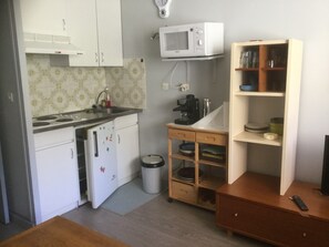 Microwave, stovetop, coffee/tea maker, cookware/dishes/utensils