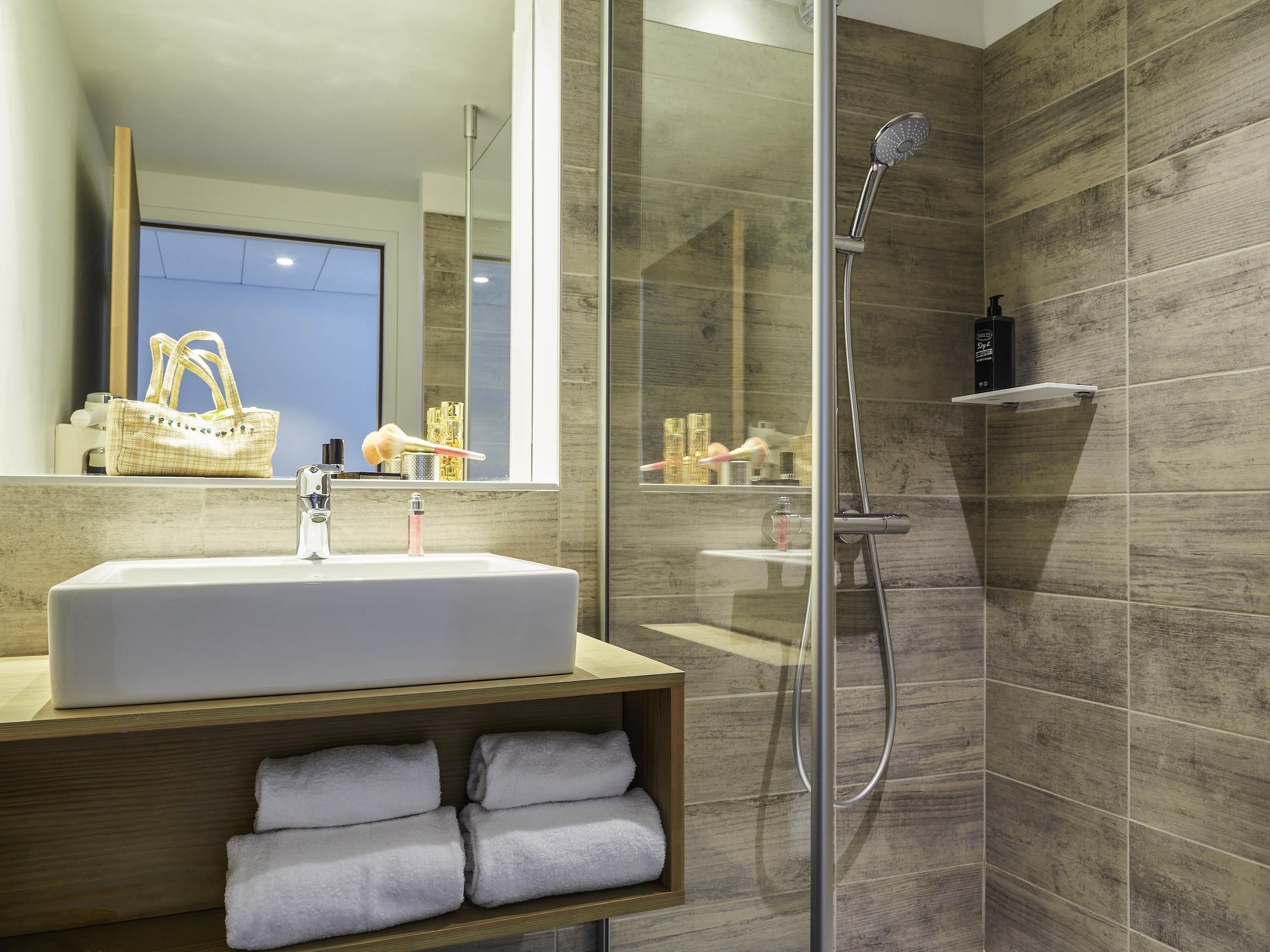 Shower, eco-friendly toiletries, hair dryer, towels