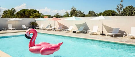 Seasonal outdoor pool, open 8:00 AM to 8:00 PM, pool umbrellas