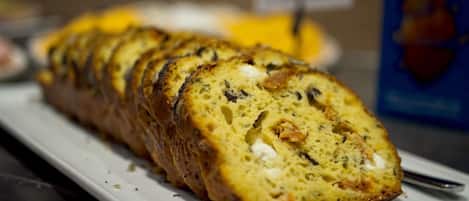 A loaf of bread on a white plate.