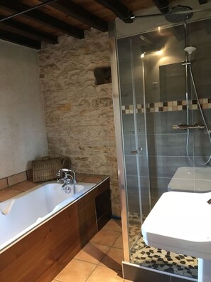 Bathtub, hair dryer, towels, soap