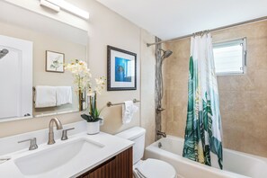 Combined shower/bathtub, hair dryer, towels, soap