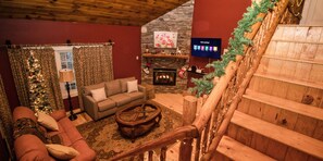 Smart TV, fireplace, books, stereo