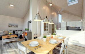 A spacious dining area with a wooden table set for four, surrounded by white chairs. A modern kitchen with white cabinets and stainless steel appliances is visible in the background. - Pet friendly home in Krems II/Warderbrück (Krems II/Warderbrück)