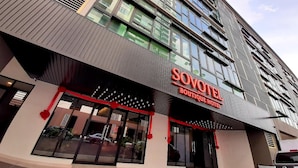 A modern hotel building with a prominent sign for 'SOVOTEL Boutique Hotel'. - Sovotel Conezion Putrajaya (Serdang)