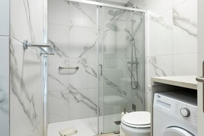 Bathtub, hair dryer, towels