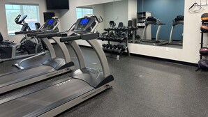 A gym with treadmills, dumbbells, and a mirrored wall. - Best Western Plus Chandler (Chandler)