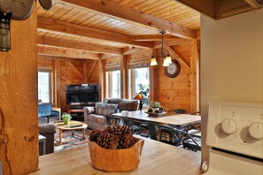 42-inch flat-screen TV with cable channels, TV, fireplace - The Killington Cabin by Killington Vacation Rentals (Killington)