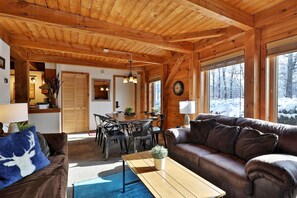 42-inch flat-screen TV with cable channels, TV, fireplace - The Killington Cabin by Killington Vacation Rentals (Killington)