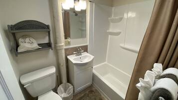 Combined shower/tub, towels, soap, toilet paper
