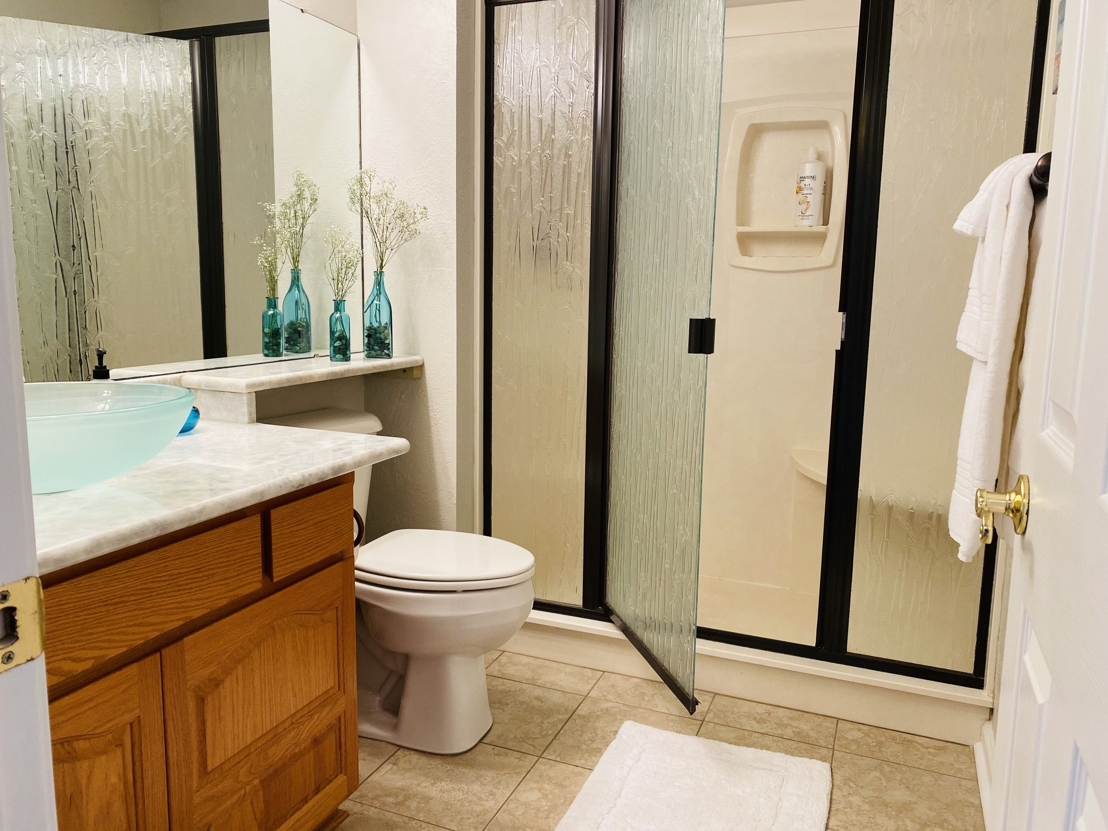 Shower, hair dryer, towels, soap