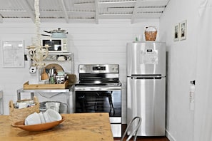 Fridge, microwave, coffee/tea maker, cookware/dishes/utensils